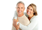 Senior couple, Diane and Richard, with healthy, glowing skin after using anti-aging, moisturizing skin oil. Smiling and radiant, their skin looks youthful and well-nourished thanks to the natural oil's hydrating and anti-aging properties.